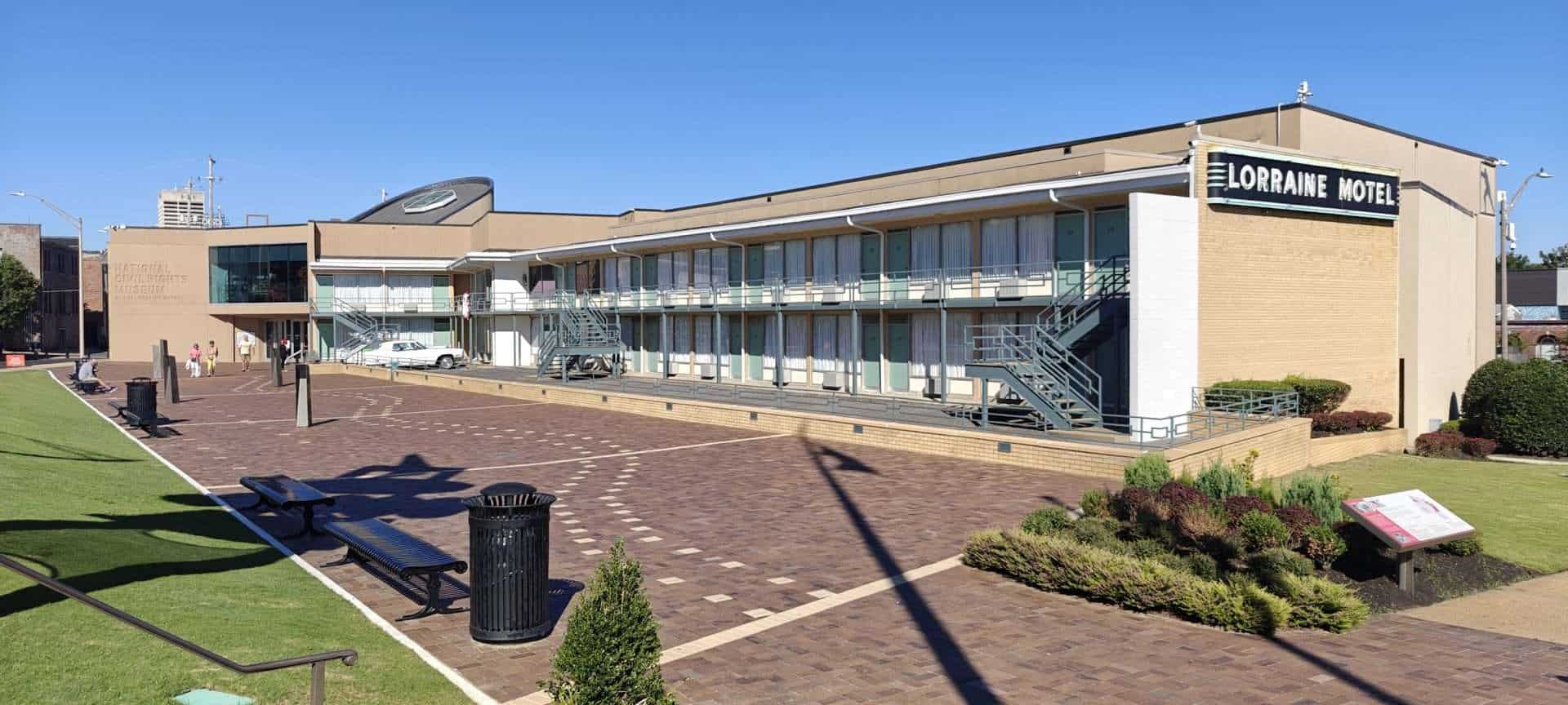 The Lorraine Motel exterior with a white Cadillac parked out front at the National Civil Rights Museum in Memphis.