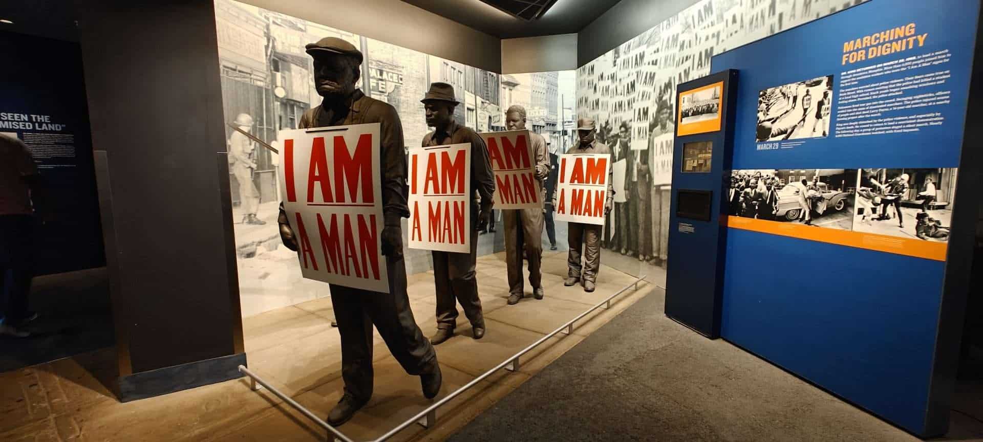 Historical civil rights protest display, African American march for dignity, historical exhibit on social justice movement, civil rights activists, museum display dedicated to activism and equality.